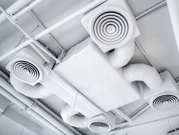 View of ceiling HVAC system at a warehouse facility