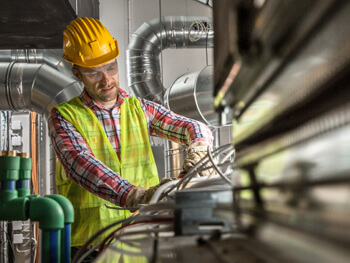 IKM team member working at an HVAC construction project